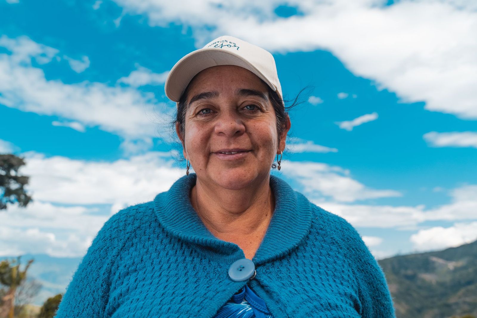 A woman coffee grower in the program, on her own farm