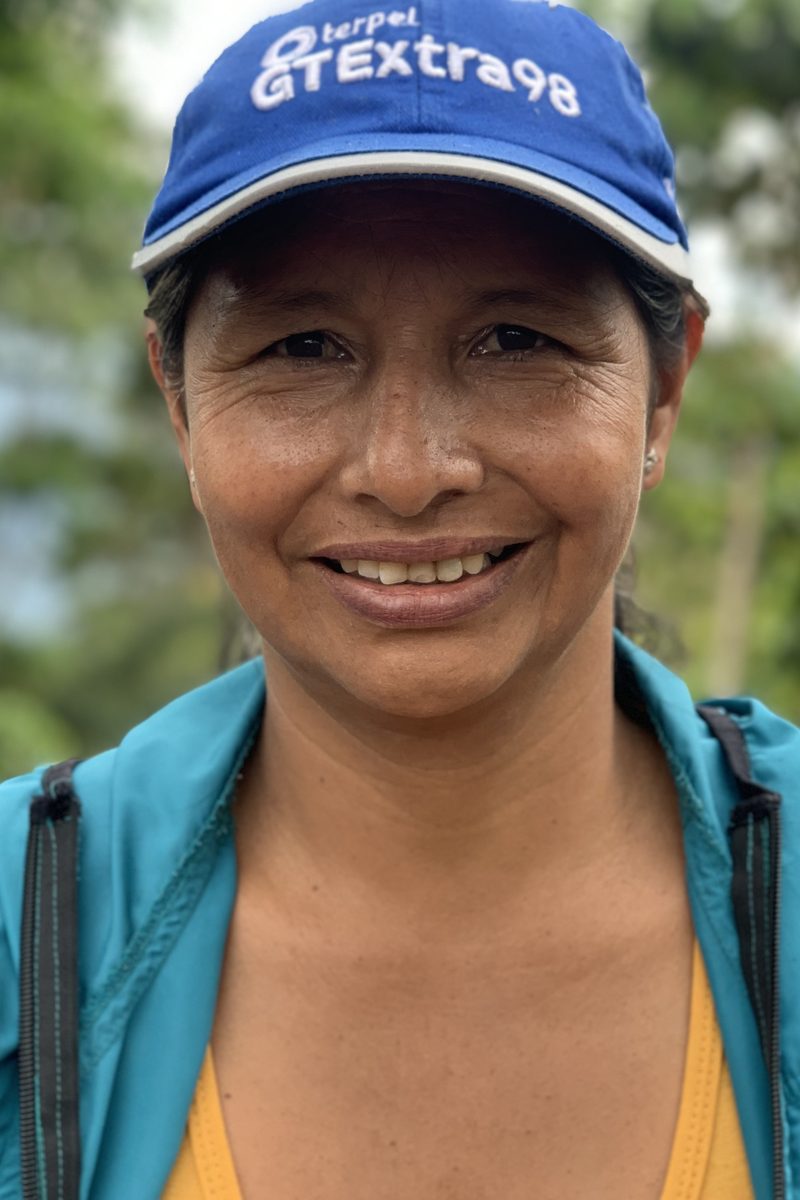 A woman coffee grower in the program on her own farm